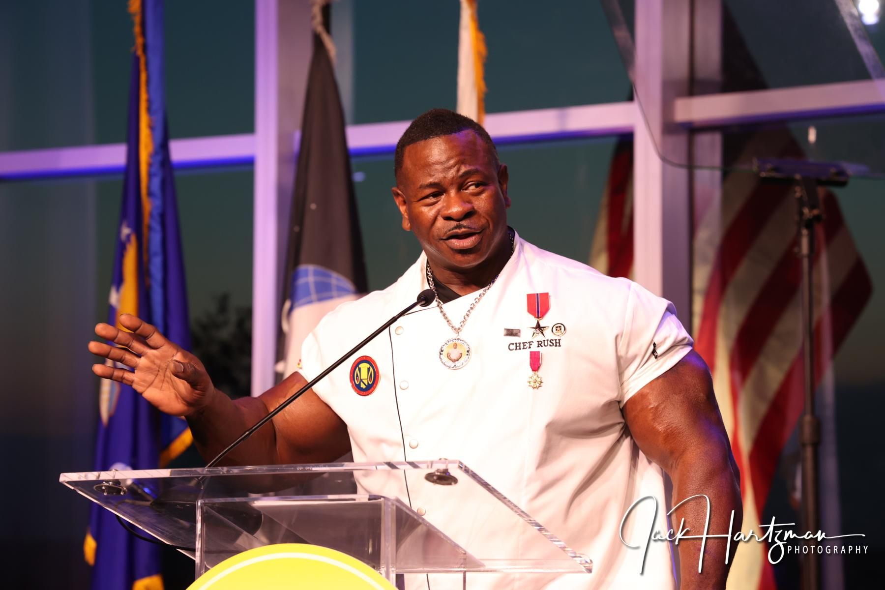 Chef Andre Rush speaking at a military service gala