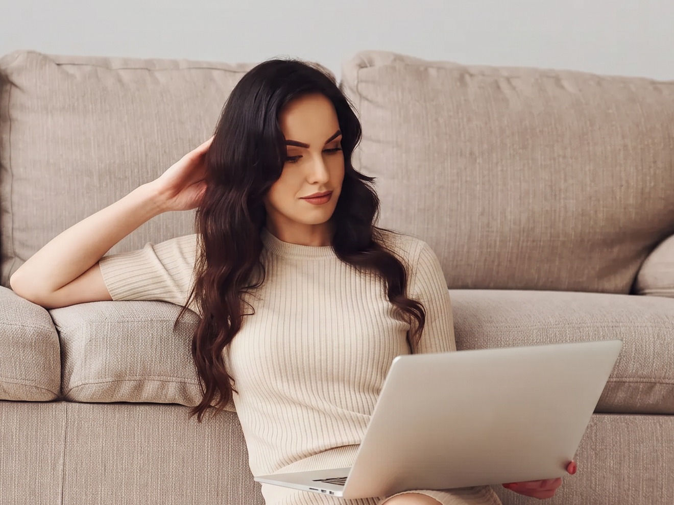 Woman at home reviewing her care plan on a laptop